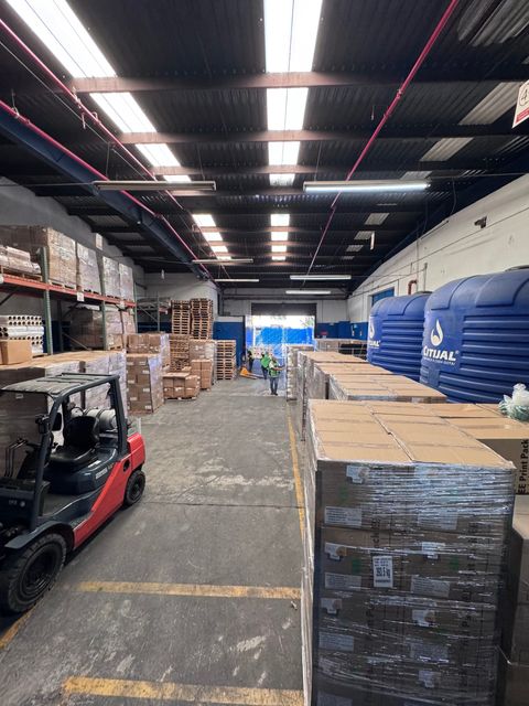Warehouse floor with palletized product and forklift, Guadalajara
