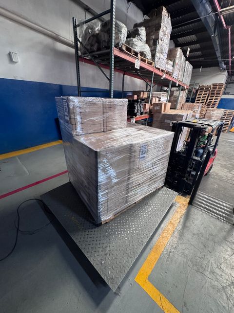 Wrapped pallets staged near the loading bay